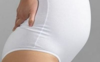Болі в спині у жінки при вагітності: причина і що робити